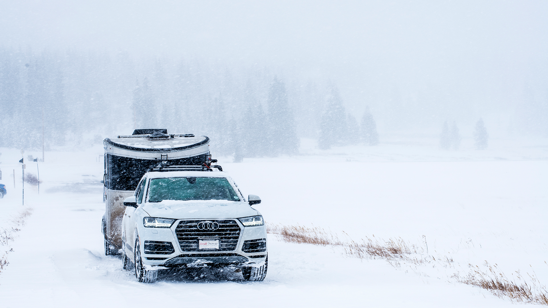 Airstream-Basecamp-Driving-Though-Snow-Audi.jpeg