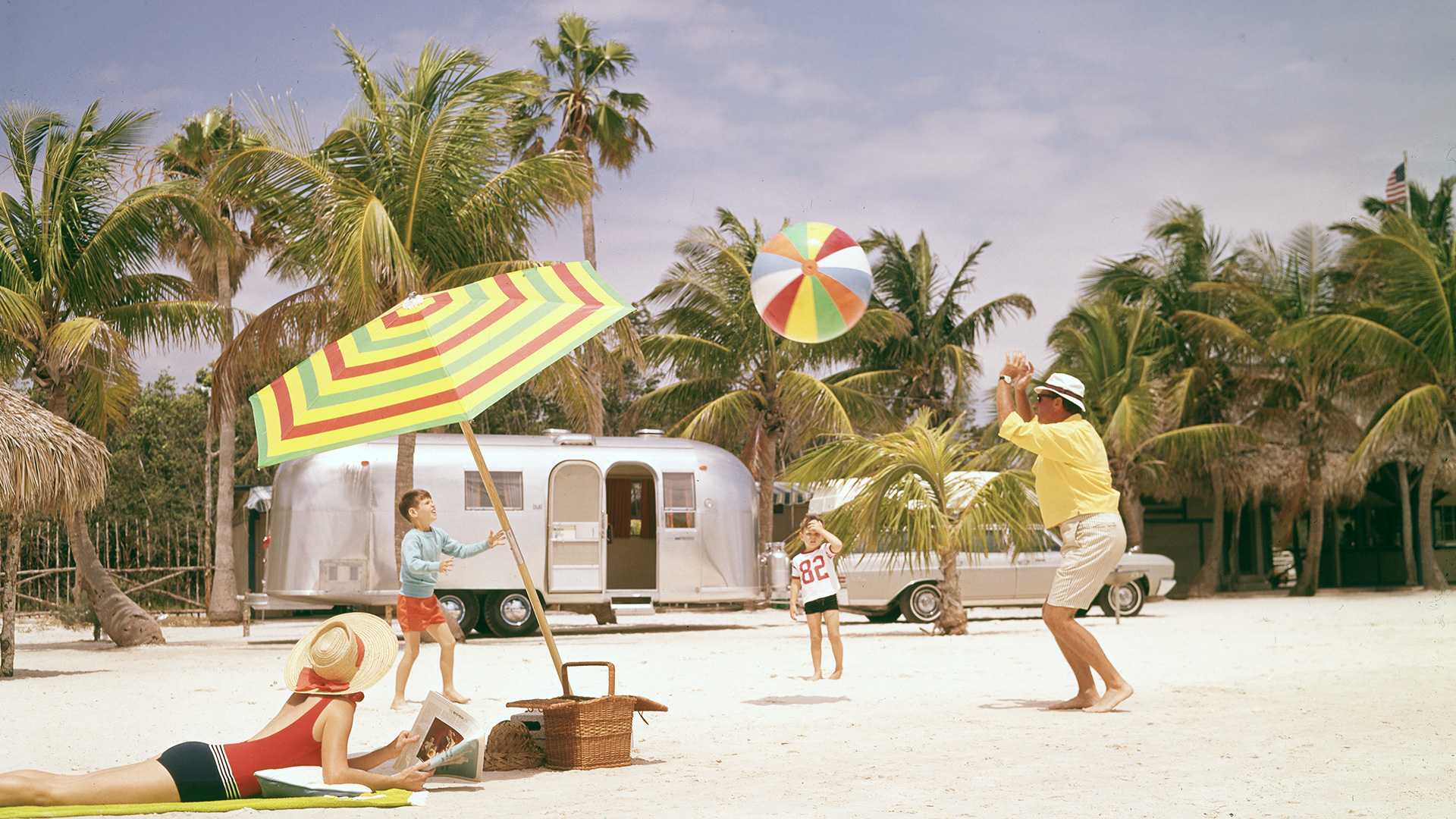 Airstream-Archives-Family-Traveling-and-Playing-Ball-on-Beach.jpeg